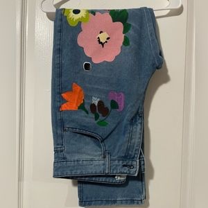 Jean pants painted art flowers.